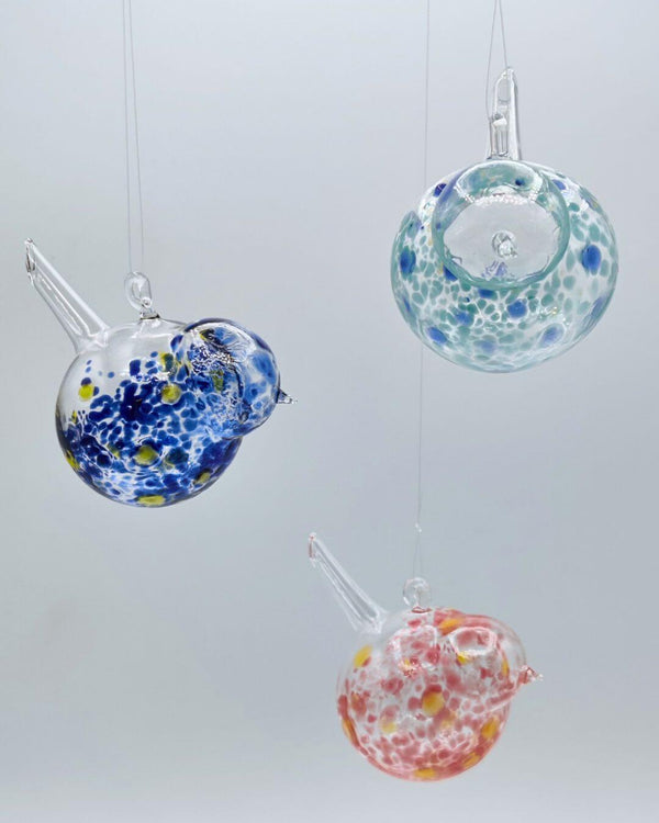 Chubby Glass Birds in vibrant colors, showcasing unique flame-blown designs and whimsical shapes.