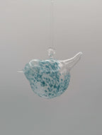 Chubby Glass Birds hanging decoration in blue and clear glass, featuring a playful shape and colorful flecks.